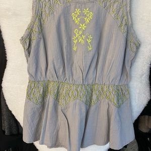 Stunning grey top with green embroidered detailing along the waist and the top